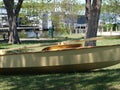 A Landlocked Sailboat Sits In the Shade.