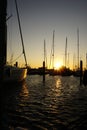 Marina with sun set. Pleasure boating boats and sailing yachts in the harbor.
