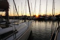 Marina with sun set. Pleasure boating boats and sailing yachts in the harbor. Royalty Free Stock Photo