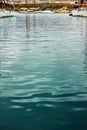 Marina - Water surface with ripple and reflection of yachts Royalty Free Stock Photo