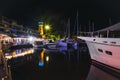 Marina with yachts and boat at the night