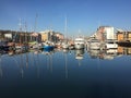 Marina yachts reflected in the water