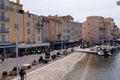 Marina with yachts, shipping boats and promenade in Saint Tropez, Cote d'Azur, French Riviera Royalty Free Stock Photo