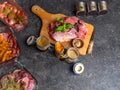 Marinade powder, spices on fresh juicy meat on Gray Background