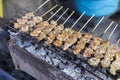 Marinate pig intestine on the grill at the food market