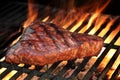 Marinated Beef Steak On The Flaming Hot BBQ Grill. Royalty Free Stock Photo