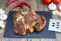 Marinated beef steak on wooden table top. Healthy food concept. Beef cut and spices for cooking bbq sauce outdoors, garden kitchen Royalty Free Stock Photo