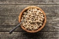 Marinated black eyed beans in wooden bowl