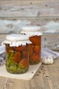 Canned tomatoes in jar on the wooden table Royalty Free Stock Photo