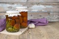 Canned tomatoes in jar on the wooden table Royalty Free Stock Photo