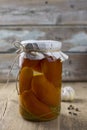 Canned tomatoes in jar on the wooden table Royalty Free Stock Photo