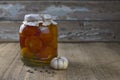 Canned tomatoes in jar on the wooden table Royalty Free Stock Photo