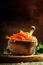 Marinated carrots in a wooden bowl, selective focus