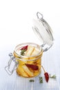 Marinated cheese in glass jar.