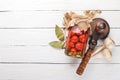 Marinated cherry tomatoes in a jar. Stocks of food. Top view. On a wooden background.