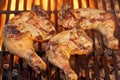 Marinated Chicken Legs Fried On The Hot Flaming BBQ Grill