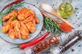 Marinated chicken wings on a baking plate with vegetables, tomatoes and spices. Raw chicken wings Royalty Free Stock Photo