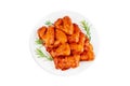 Marinated chicken wings in red sauce on isolated white background.Top view.Copy space.Semifinished. Fast cooking.Raw Royalty Free Stock Photo