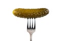 Marinated cornichon on the fork isolated on the white background Royalty Free Stock Photo