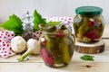 Marinated cucumbers gherkins. Marinated pickled cucumbers with red currant berries and spices on the kitchen wooden table