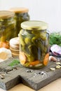 Marinated cucumbers gherkins. Marinated pickles with garlic on the kitchen table Royalty Free Stock Photo
