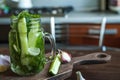 Marinated cucumbers gherkins. Pickles with mustard and garlic. Glass jar with fermented cucumbers on grey table. Pickled cucumbers Royalty Free Stock Photo