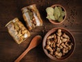 Marinated forest mushrooms in jars and bowl Royalty Free Stock Photo