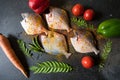 Marinated fresh fish with vegetables on a black background. Royalty Free Stock Photo