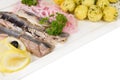 Marinated herring with onion and balls of potato