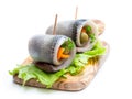 Marinated herring rolls with vegetables Royalty Free Stock Photo