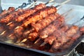 Marinated meat shashlik on preparing on barbecue grill. Roast Beef Kebabs being on BBQ in steam and smoke. Closeup meat skewers. Royalty Free Stock Photo