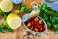 Marinated mussels in oil with lemon and greens