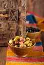 Marinated Olives in bowls with moroccan ornament on wood Royalty Free Stock Photo