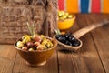 Marinated Olives in bowls with moroccan ornament on wood Royalty Free Stock Photo