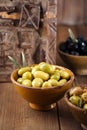 Marinated Olives in bowls with moroccan ornament on wood Royalty Free Stock Photo