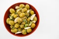 Marinated olives with garlic and herbs in bowl Royalty Free Stock Photo