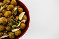 Marinated olives with garlic and herbs in bowl Royalty Free Stock Photo