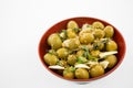 Marinated olives with garlic and herbs in bowl Royalty Free Stock Photo