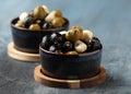 Marinated olives with herbs and garlic in bowl Royalty Free Stock Photo