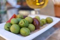 Marinated olives with herbs and spices in a small plate on the tapas bar table typical Spanish black green split olive Royalty Free Stock Photo