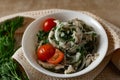 Marinated oyster mushrooms, garnished with cherry tomatoes and green dill