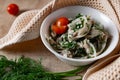 Marinated oyster mushrooms, garnished with cherry tomatoes and green dill