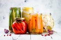 Marinated pickles variety preserving jars. Homemade green beans, squash, cauliflower, carrots, red chili peppers pickles. Royalty Free Stock Photo