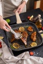 marinated pieces of Organic Tuna Steak frying on a hot grill pan