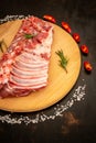 Marinated pork chop. Fresh sliced pork. Sale of meat. Preparation for grilling. black background, view from above, close-up Royalty Free Stock Photo