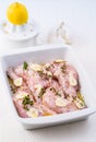 Marinated rabbit legs with lemon and garlic Royalty Free Stock Photo