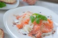 Marinated salmon carpaccio salad with basilic