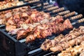 Marinated shashlik preparing on a barbecue grill over charcoal. Shashlik or Shish kebab popular in Eastern Europe. Shashlyk skewe