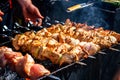 Marinated shashlik preparing on a barbecue grill over charcoal. Shashlik or Shish kebab popular in Eastern Europe. Royalty Free Stock Photo