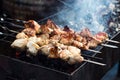 Marinated shashlik preparing on a barbecue grill over charcoal. Shashlik or Shish kebab popular in Eastern Europe. Shashlyk skewe Royalty Free Stock Photo